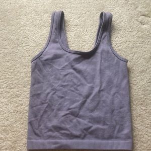 A new day tank top which is brand new, size small, color purple